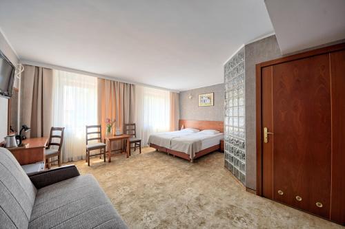 Ένα ή περισσότερα κρεβάτια σε δωμάτιο στο Hotel Przepióreczka