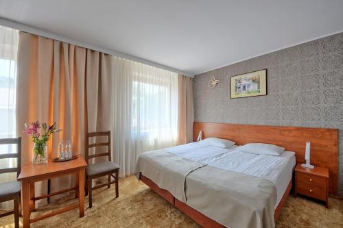 Ένα ή περισσότερα κρεβάτια σε δωμάτιο στο Hotel Przepióreczka