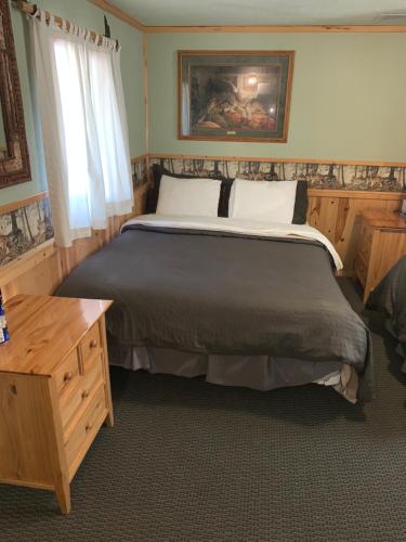 Postel nebo postele na pokoji v ubytování Glacier Haven Inn