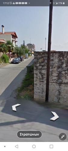a view of a street with arrows on the road at oniron in Sidhirókastron