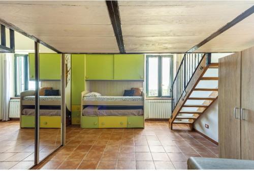 a room with two bunk beds and a staircase at La Torre di Barbara in Ardea