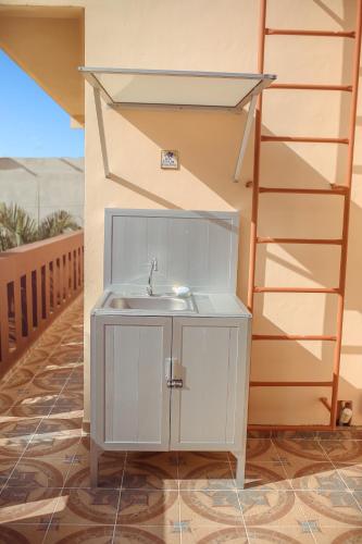 a bathroom with a sink next to a staircase at Casa Saab in Playa del Carmen
