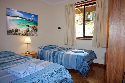 a hotel room with two beds and a window at Kangaroo Island Coastal Villas in American River