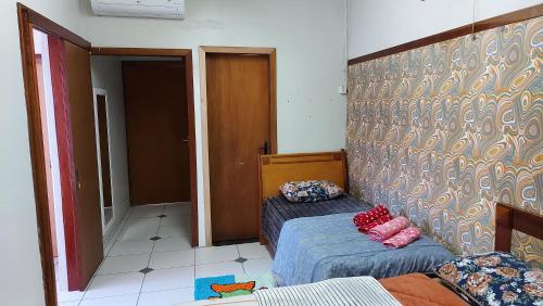 Ένα ή περισσότερα κρεβάτια σε δωμάτιο στο Hostel pé da serra