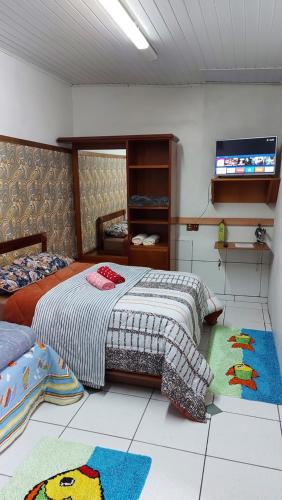 Ένα ή περισσότερα κρεβάτια σε δωμάτιο στο Hostel pé da serra