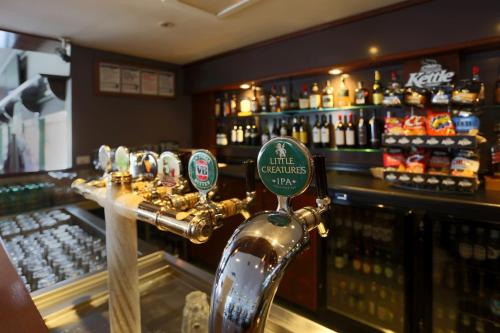 a bar with a drink dispenser on the counter at Nightelier Doncaster in Doncaster