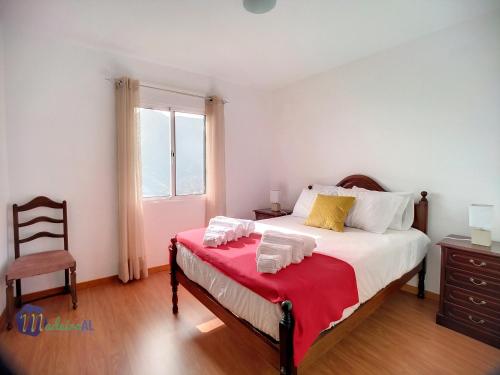 Postel nebo postele na pokoji v ubytování Casa do Romaninho