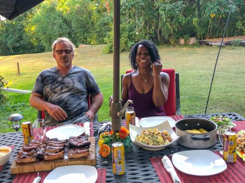 a man and a woman sitting at a table with food at Nature Oasis Bar Room in Dundas