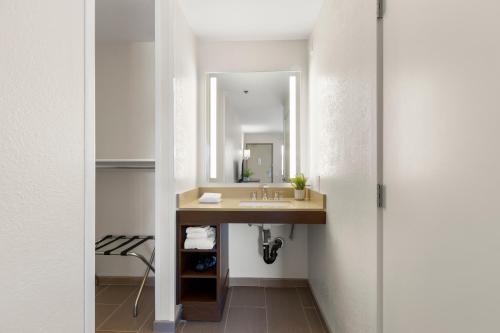 a bathroom with a sink and a mirror at Good Nite Inn Camarillo in Camarillo