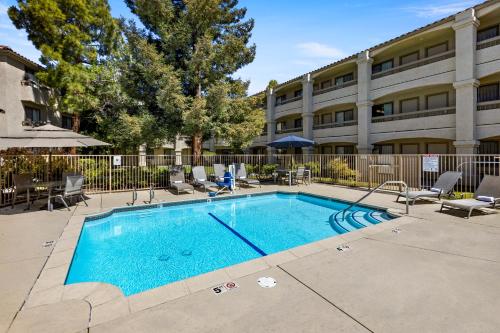 a swimming pool in front of a building at Good Nite Inn Fremont in Fremont