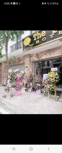 a store with a bunch of flowers in front of it at Hotel The Quin in Hai Phong