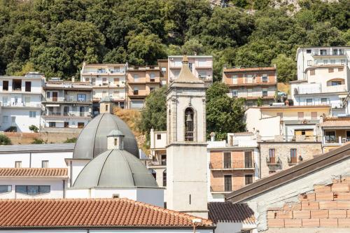 a city skyline with buildings and a clock tower at Bed and Terrace Caterina in Baunei