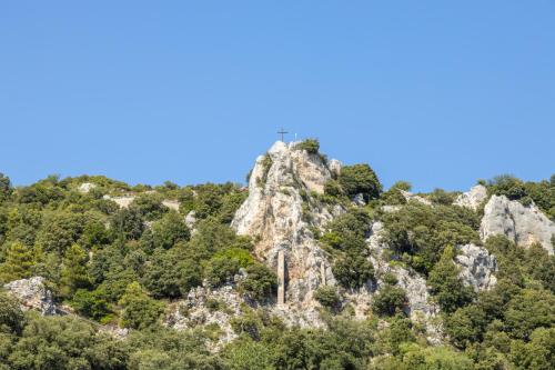 a mountain with a cross on top of it at Bed and Terrace Caterina in Baunei