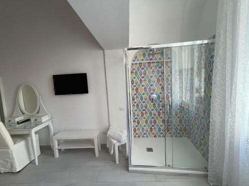 a bathroom with a shower with a glass door at B&B ROSSELLA Vietri in Vietri sul Mare