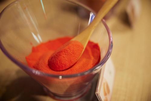 a cup with a spoon with red liquid in it at HOTEL WiLL EX 大高 レジャーホテル in Nagoya