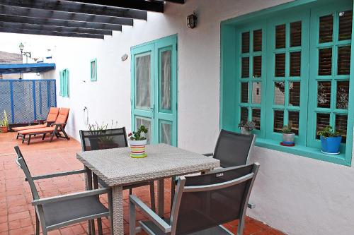 a table and chairs sitting on a patio at Casa Belén in Pozo Negro