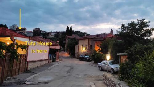 a village street with a sign that reads little house is here at Tuta House Sighnaghi in Sighnaghi