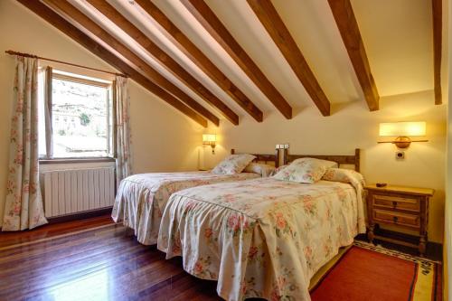 a bedroom with a bed and a window at Casa Lamadrid in Cahecho