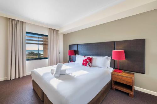Postelja oz. postelje v sobi nastanitve Harbourfront Darwin Escape with Sea Views and Pool