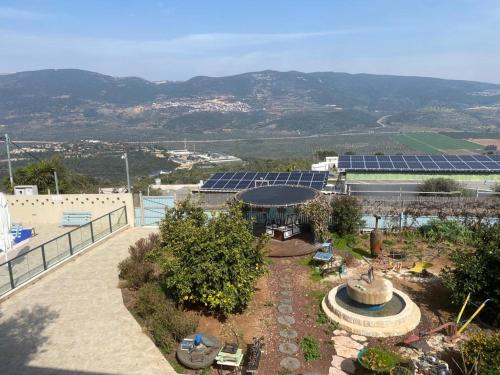 an aerial view of a building with a garden at בית הכרם in H̱azon