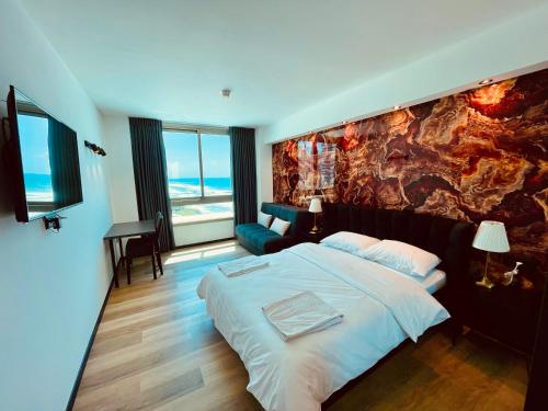 Postel nebo postele na pokoji v ubytování Carmel Holiday Apartments