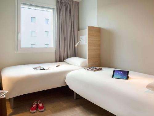 Voodi või voodid majutusasutuse ibis budget Fribourg toas