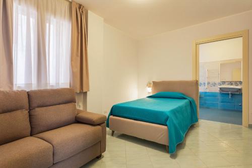 A bed or beds in a room at Casa vacanze Luigi e Rachele