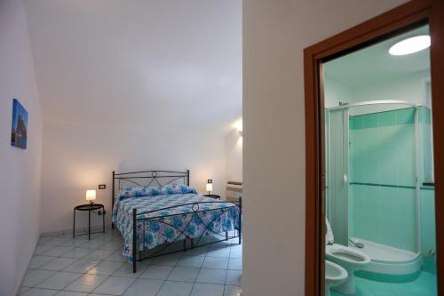 Posteľ alebo postele v izbe v ubytovaní Appartamento panoramico la rosa dei venti-Libeccio