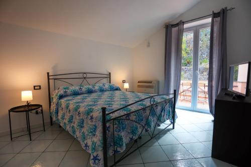 Postel nebo postele na pokoji v ubytování Appartamento panoramico la rosa dei venti-Libeccio