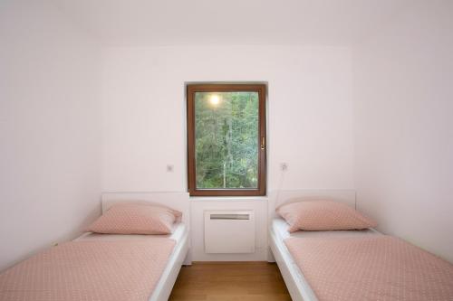 Postel nebo postele na pokoji v ubytování Apartment Vera Kranjska Gora