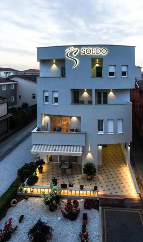 a building with a sign on the side of it at Hotel Soldo in Međugorje