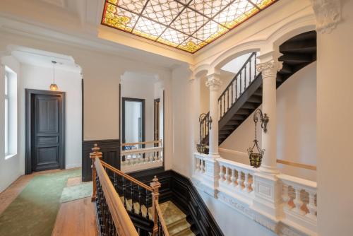 a skylight in the ceiling of a hallway with stairs at Maison Mimerel Colodge in Roubaix