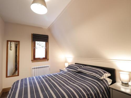 Posteľ alebo postele v izbe v ubytovaní 2 Glen Garry Lodge