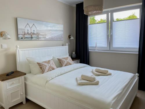 Postel nebo postele na pokoji v ubytování My Baltic Sea - Ferienwohnungen im Seaside House