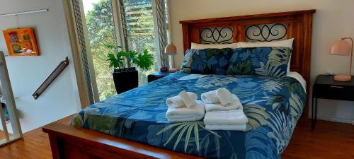 a bedroom with a bed with towels on it at Potters Place Montville in Montville