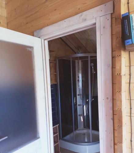a sliding glass door in a bathroom in a house at Agroturystyka Jeleń in Jeleń