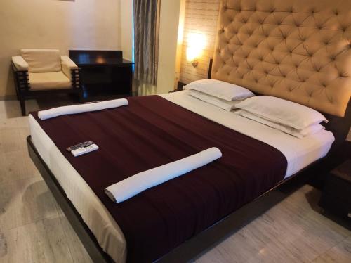 Ένα ή περισσότερα κρεβάτια σε δωμάτιο στο Hotel Vaishnavi