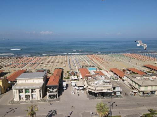 an aerial view of a beach with a large parking lot at Villa Tina Hotel in Viareggio