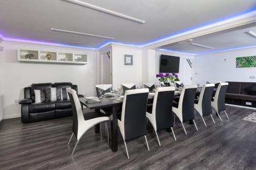 a dining room with a table and chairs at Four Oaks House in Carlisle