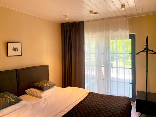 Postelja oz. postelje v sobi nastanitve Kaluri Villa Külalistemaja