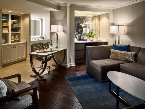 a living room with a couch and a table at The Hotel at Auburn University in Auburn