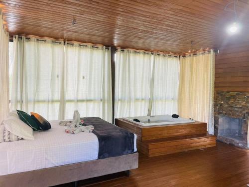 Postel nebo postele na pokoji v ubytování Recanto- Pousada Cachoeira da Neve