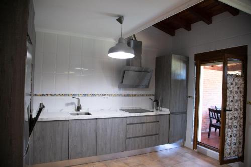 a kitchen with a sink and a counter top at Tu casa in Casasola