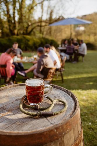 a cup of tea sitting on top of a wooden table at The Cotley Inn in Wambrook