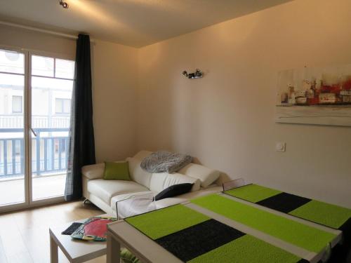 Giường trong phòng chung tại LES BALCONS DE L'OCEAN