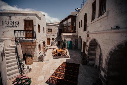 an alley with a table in a building at Juno Cappadocia Adults Only in Uchisar