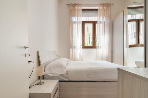 Ένα ή περισσότερα κρεβάτια σε δωμάτιο στο Duomo Apartment - Diaz