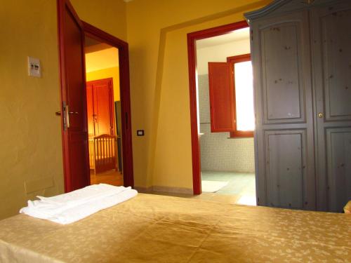 Ένα ή περισσότερα κρεβάτια σε δωμάτιο στο Agriturismo Simbirizzi