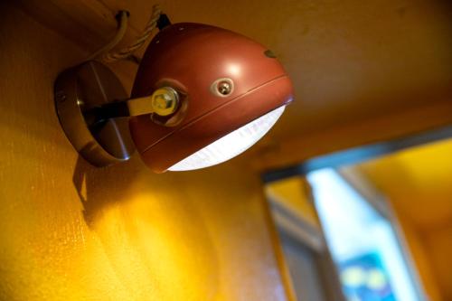 a close up of a helmet on a door knob at Princess Hostel Leidse Square Amsterdam in Amsterdam