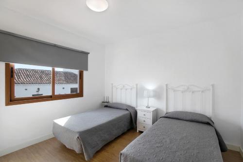 Ένα ή περισσότερα κρεβάτια σε δωμάτιο στο Casa Micaela 2